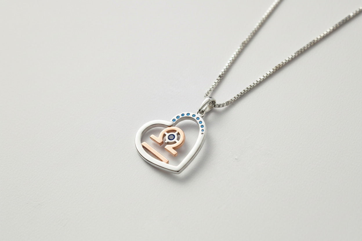 Zodiac Libra Heart Pendant on a 925 Sterling Silver Chain With Rose Gold Detailling, and Sapphire Blue Zircon Gemstones