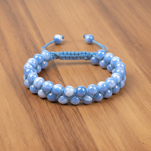 Blue beaded bracelet on a wooden surface