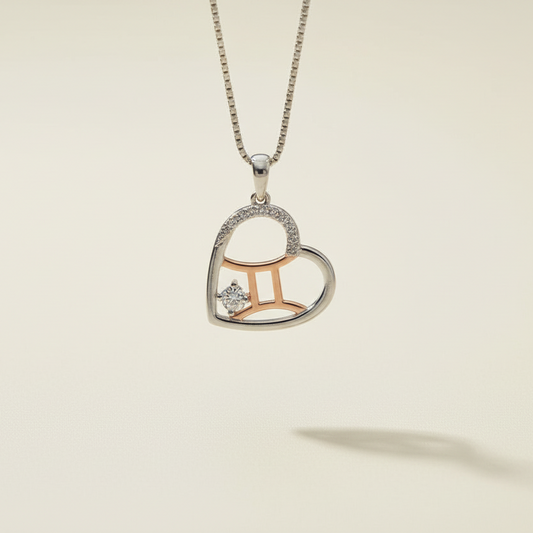 Heart-shaped pendant with zodiac sign design on a beige background