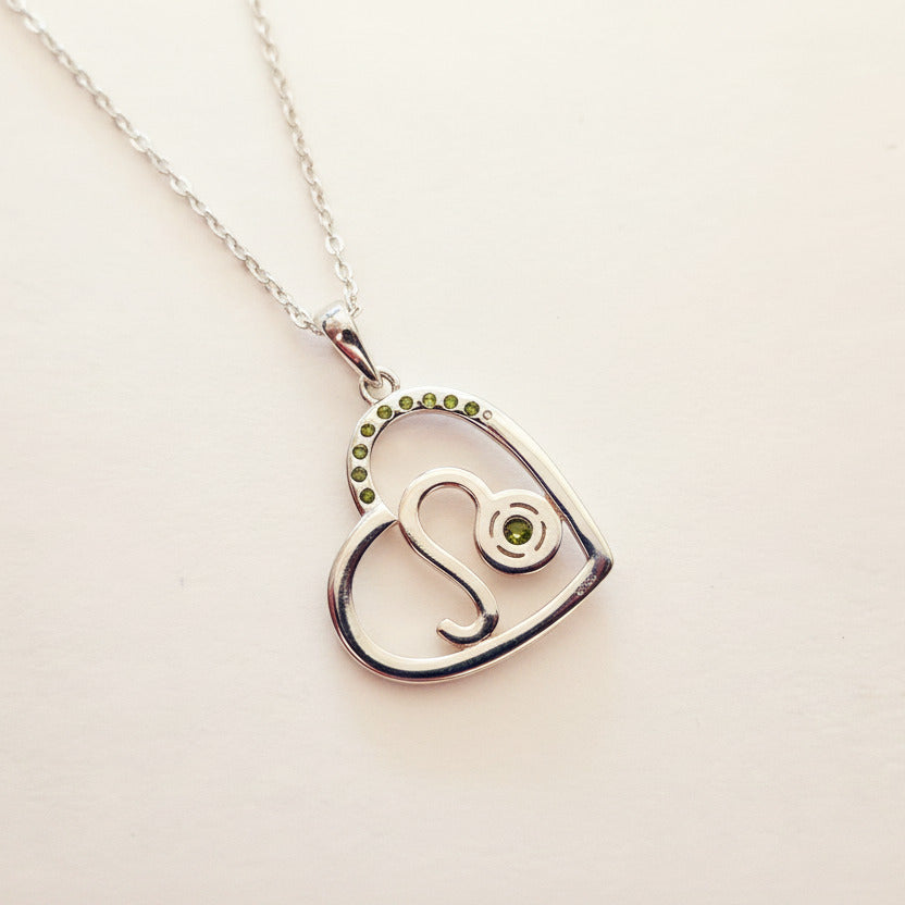 Zodiac Leo Heart Pendant on a 925 Sterling Silver Chain With Rose Gold Detailling, and Peridot Zircon Gemstones