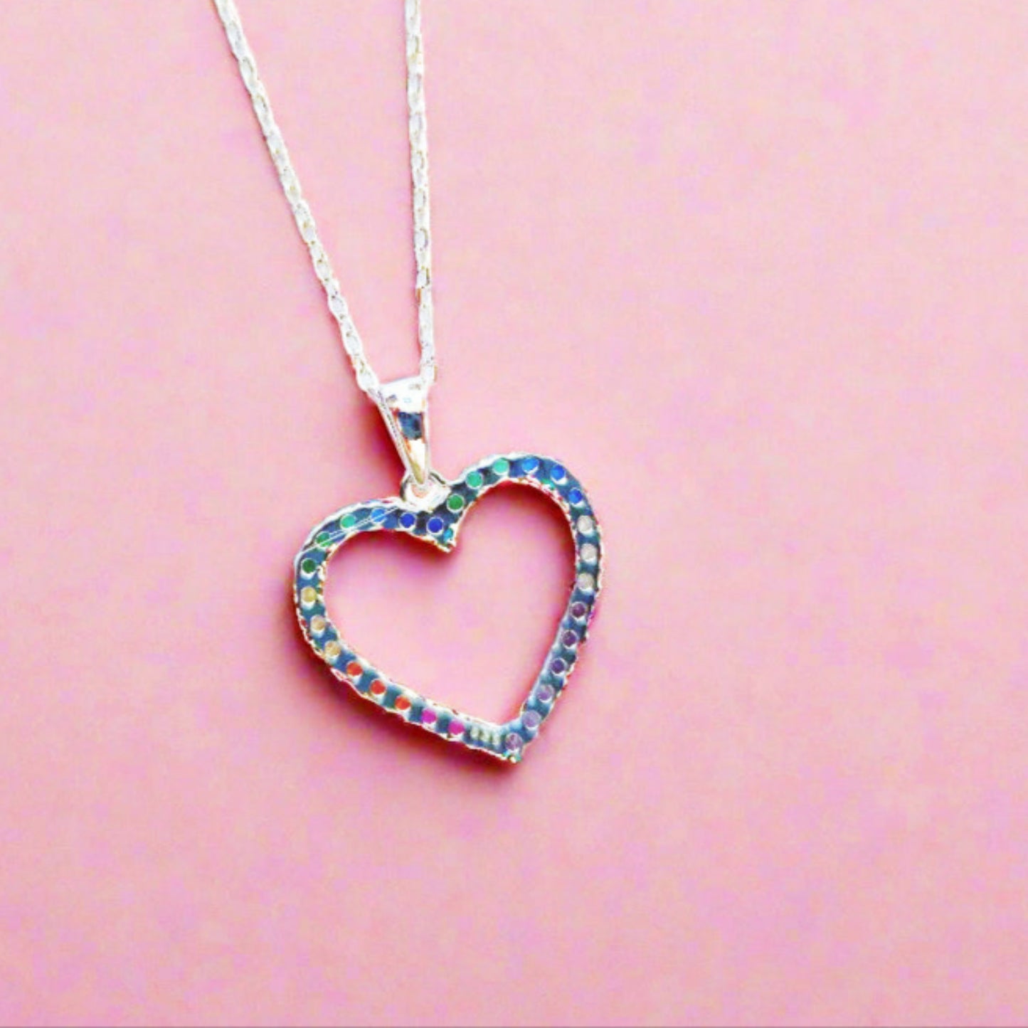 Sterling Silver Heart Pendant with Rainbow Coloured Gemstones  The Fine Silver Rope Chain is adjustable.