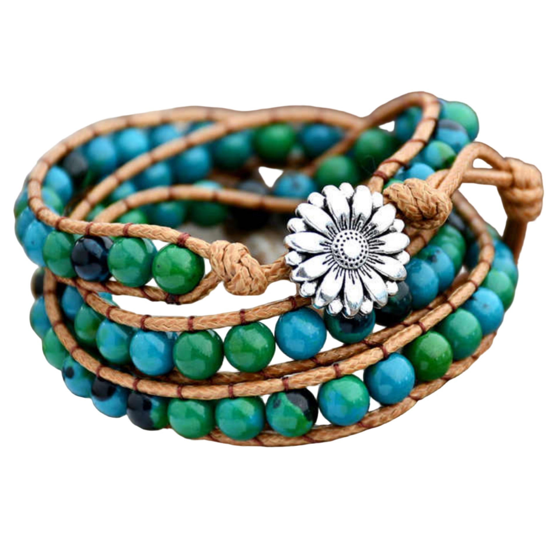 Multistrand beaded bracelet with a silver flower charm on a wooden surface